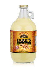 Load image into Gallery viewer, Jake's StrongGinger 64oz glass bottle filled with organic Peruvian ginger juice, perfect for a spicy kick.