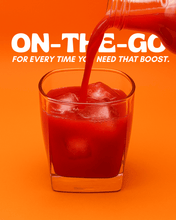 Load image into Gallery viewer, Glass of Jake's StrongGinger organic pomegranate ginger juice highlighting it's convenience for people on the go!