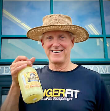 Tryg Jacobson, the new Jake holding a bottle of Jake's StrongGinger organic ginger juice