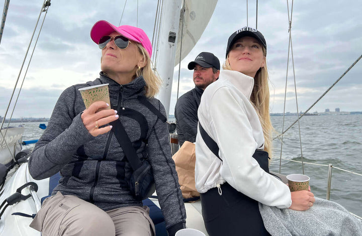 Jake's wife, Ann Marie and Christiana on the deck of a yacht depicting the adventurous spirit of Jake's StrongGinger organic ginger juice