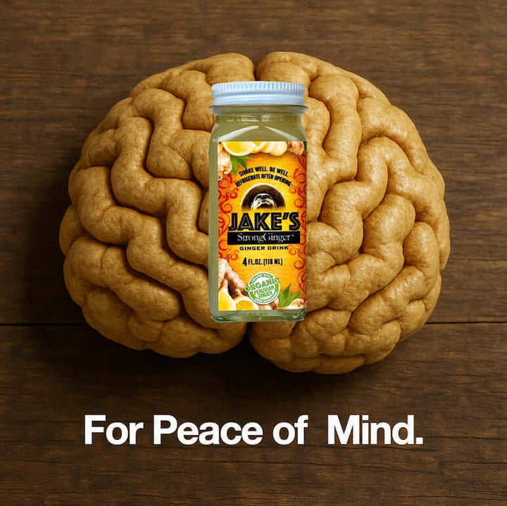 A 4oz bottle of Jake's StrongGinger organic ginger juice on top of a brain to communicate that ginger is good for brain health