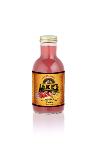 Jake's StrongGinger Pomegranate 12oz glass bottle with organic Peruvian ginger juice.