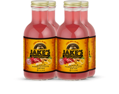Six bottles of Jake's StrongGinger organic pomegranate ginger drink, a wellness beverage for digestion and immunity.