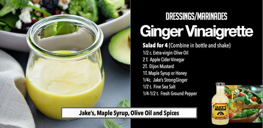 Jar of homemade ginger vinaigrette beside a fresh green salad and Jake’s StrongGinger.