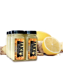Load image into Gallery viewer, A six pack of 4oz Jake&#39;s StrongGinger bottles in front of fresh organic ginger and lemons
